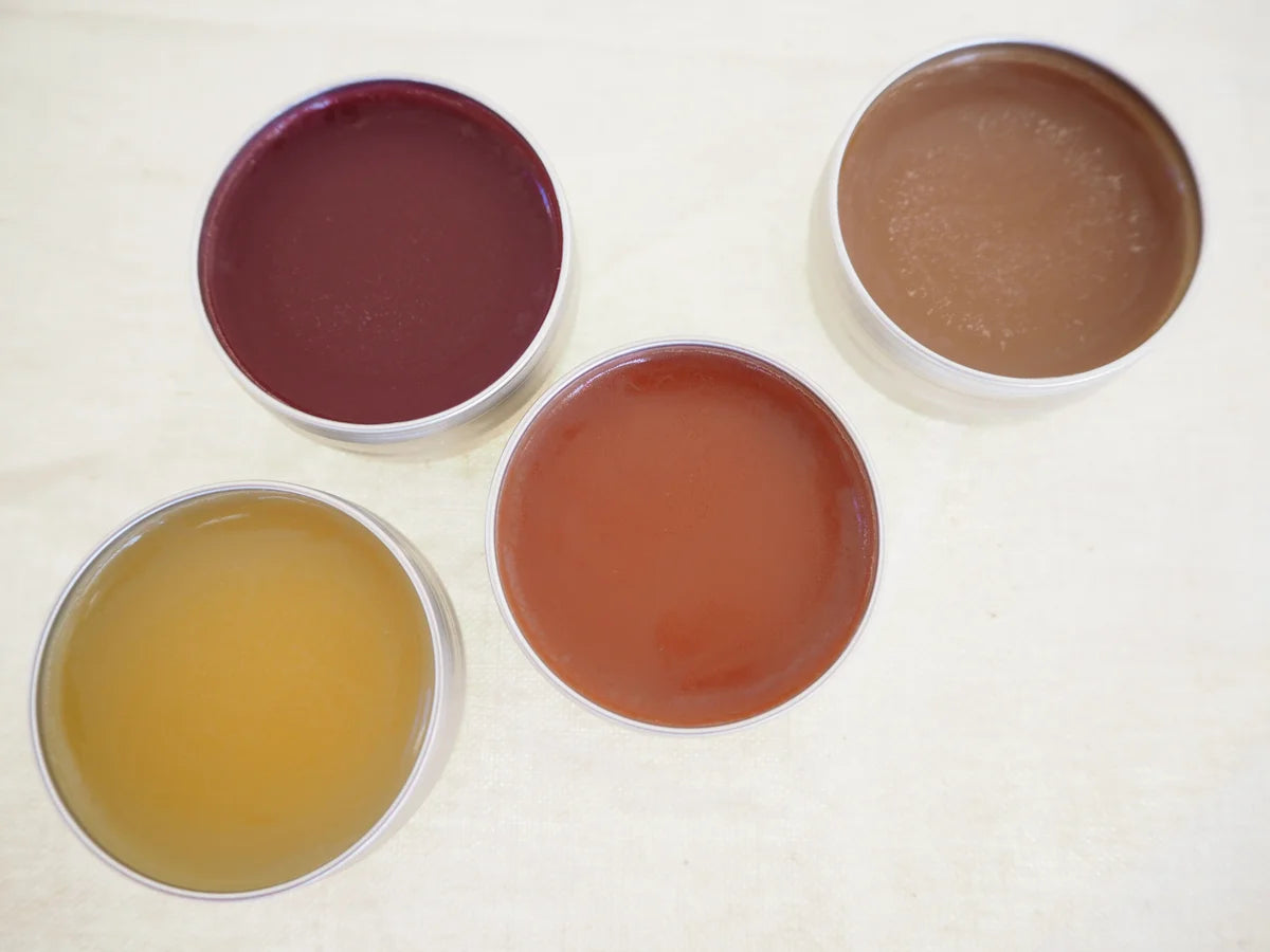 Lip balm with lips off showing vibrant colours